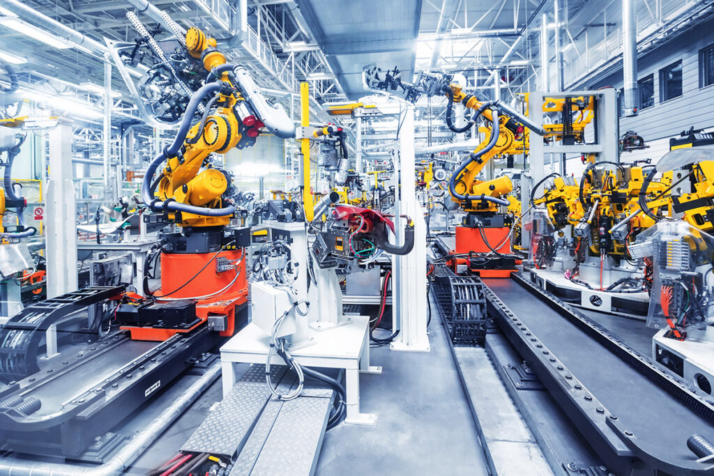 A modern industrial car factory assembling cars.