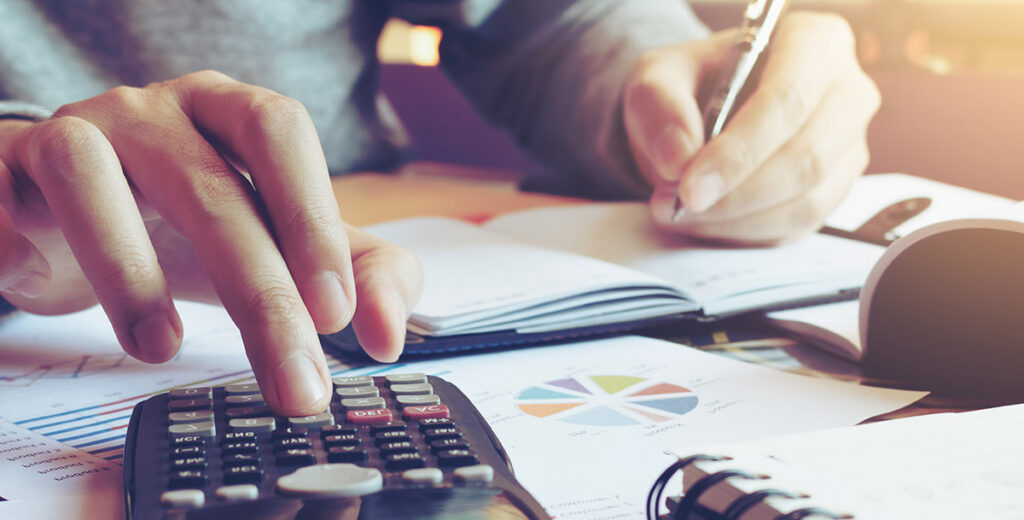 A man calculating numbers manually.