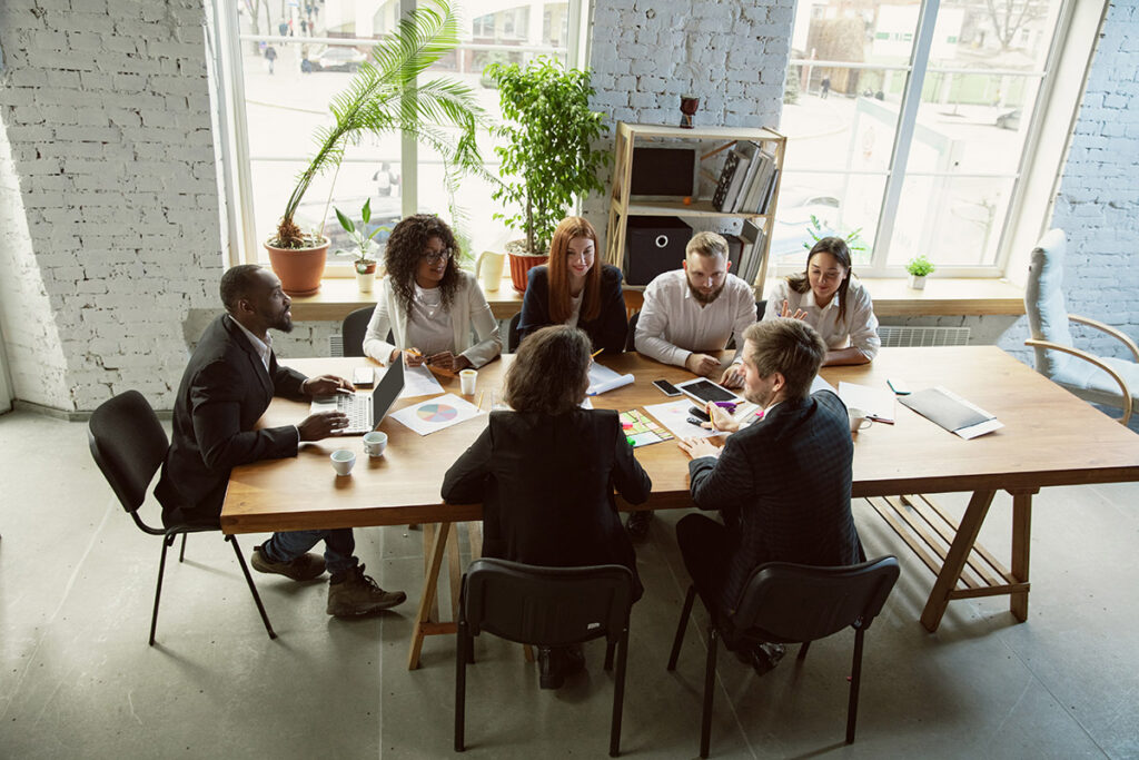 A group of people working together at a table.