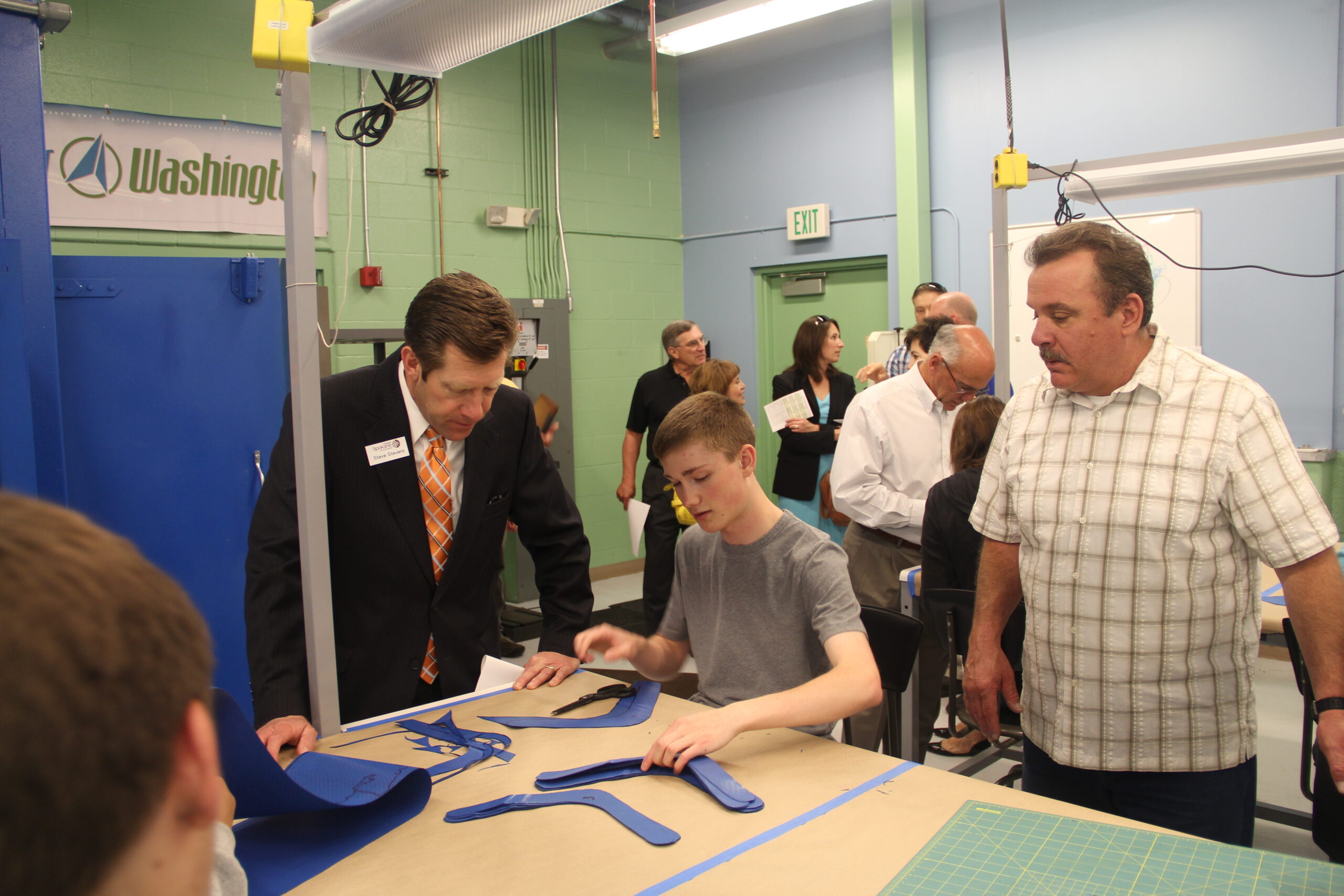Steve visits with a high school student in a summer program at Spokane Community College's Composites Lab.