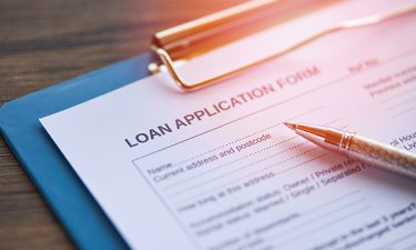 Loan application form with pen on paper / financial loan negotia